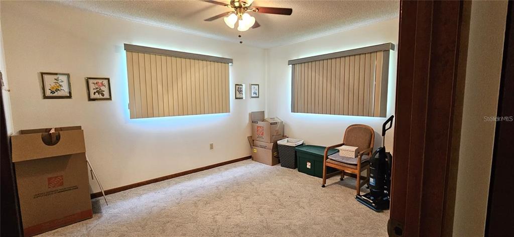 10881 Southwest 79th Terrace Ocala, FL 34476 - Photo 17 of 38 a livingroom with workspace and a window