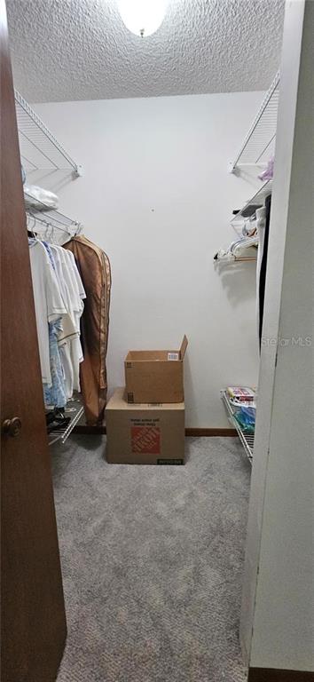 10881 Southwest 79th Terrace Ocala, FL 34476 - Photo 18 of 38 a view of room with clothes