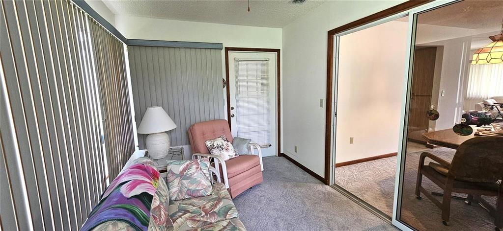 10881 Southwest 79th Terrace Ocala, FL 34476 - Photo 20 of 38 a bedroom with a bed and a chandelier