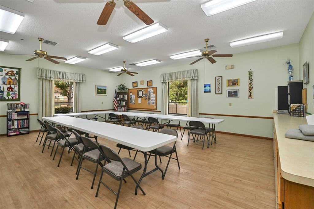 10881 Southwest 79th Terrace Ocala, FL 34476 - Photo 36 of 38 a view of a dining room with furniture and wooden floor