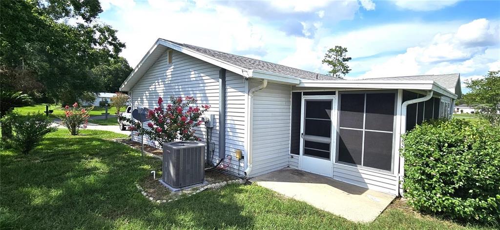 10881 Southwest 79th Terrace Ocala, FL 34476 - Photo 4 of 38 a front view of a house with garden