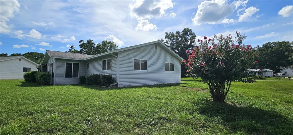 10881 Southwest 79th Terrace Ocala, FL 34476 - Photo 6 of 38 a view of a house with backyard and garden