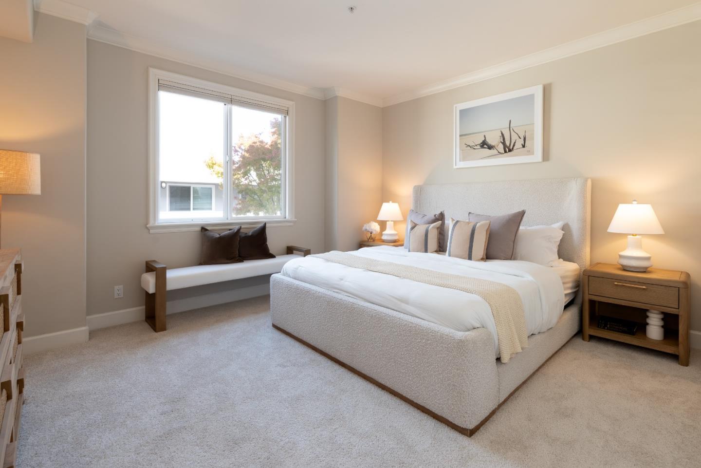 1237 Capuchino Avenue, Unit 7 Burlingame, CA 94010 - Photo 16 of 40 a spacious bedroom with a bed and a couch