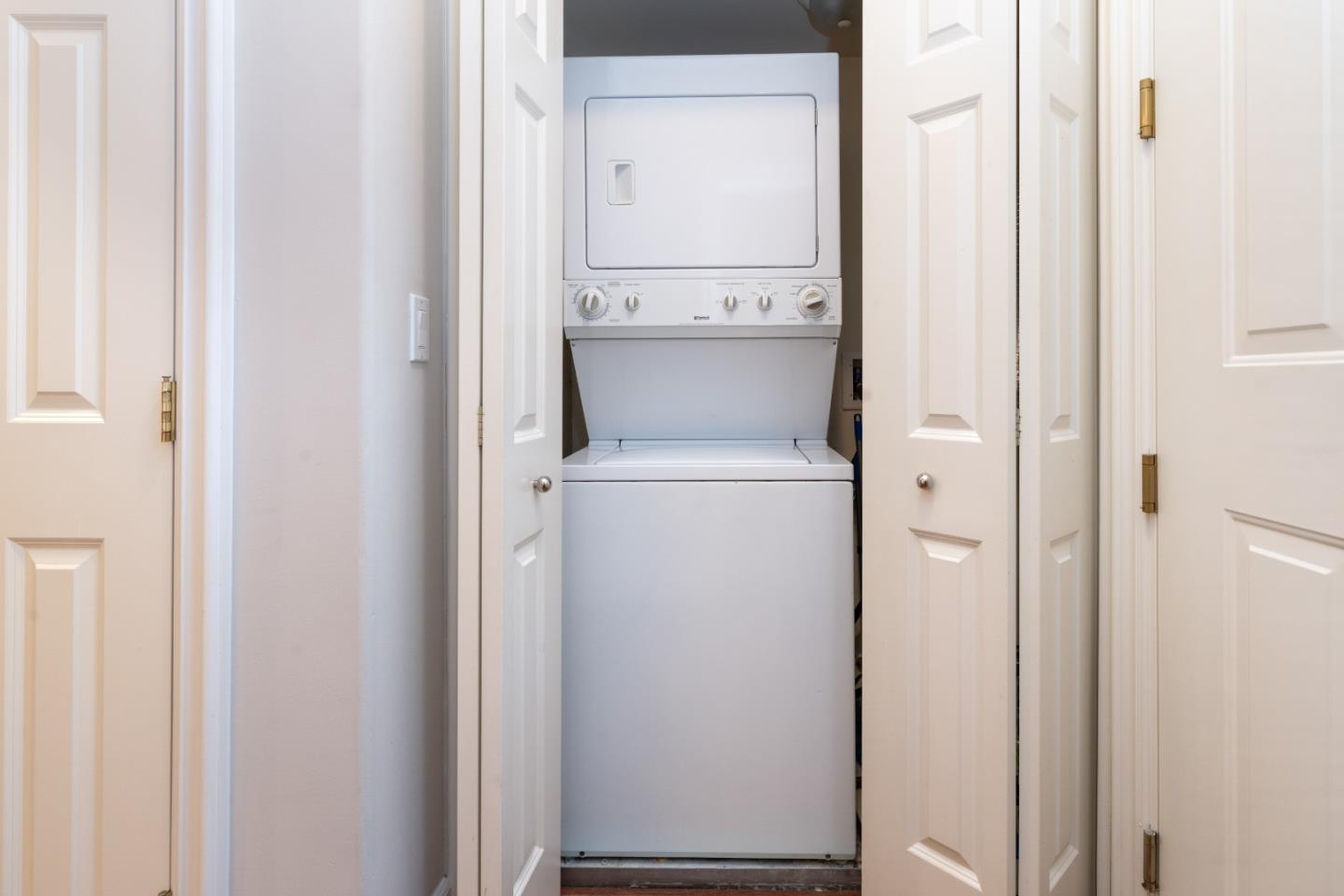 1237 Capuchino Avenue, Unit 7 Burlingame, CA 94010 - Photo 29 of 40 a utility room with dryer and washer
