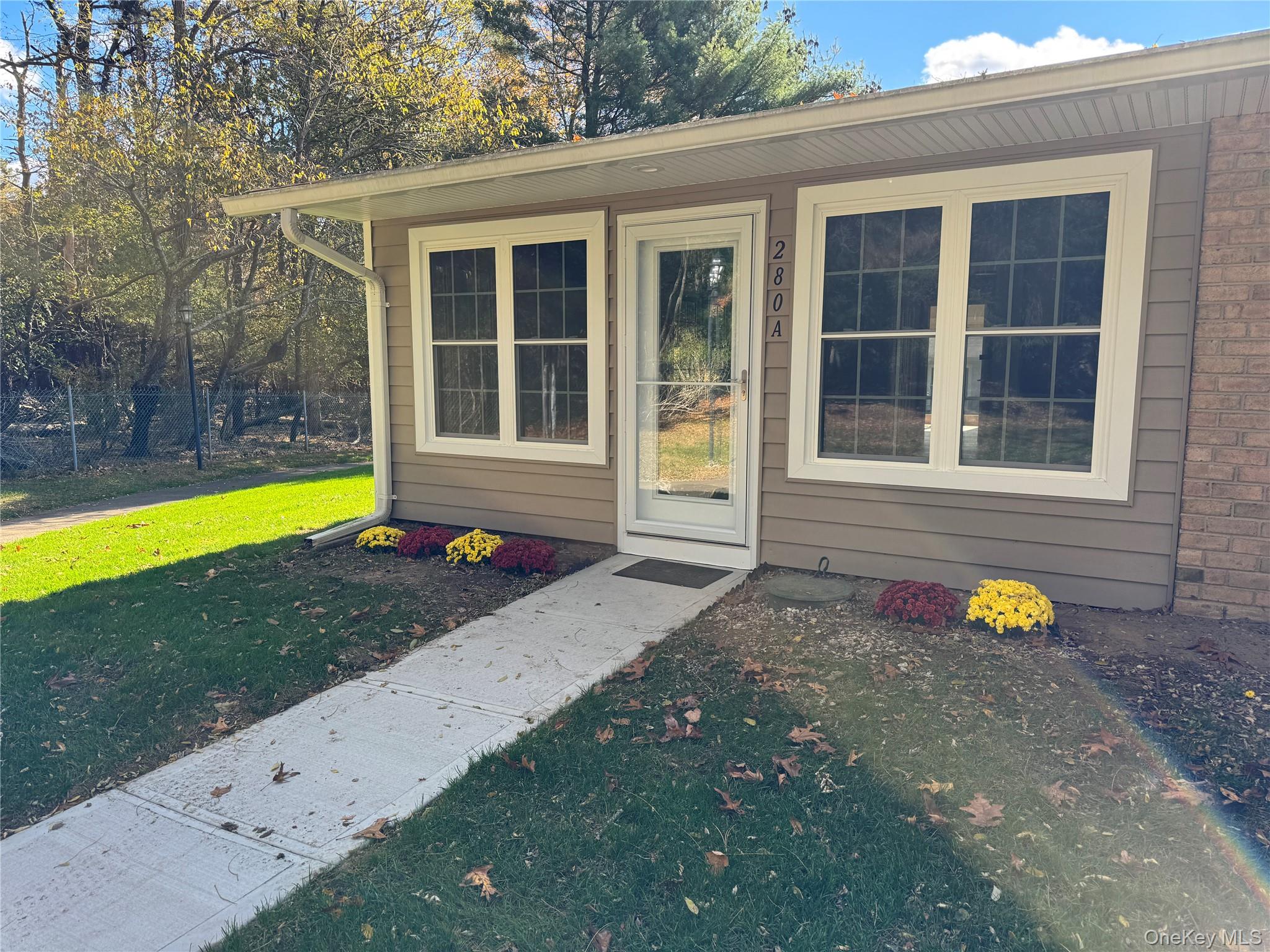 a view of a lounge chair in the backyard of a house