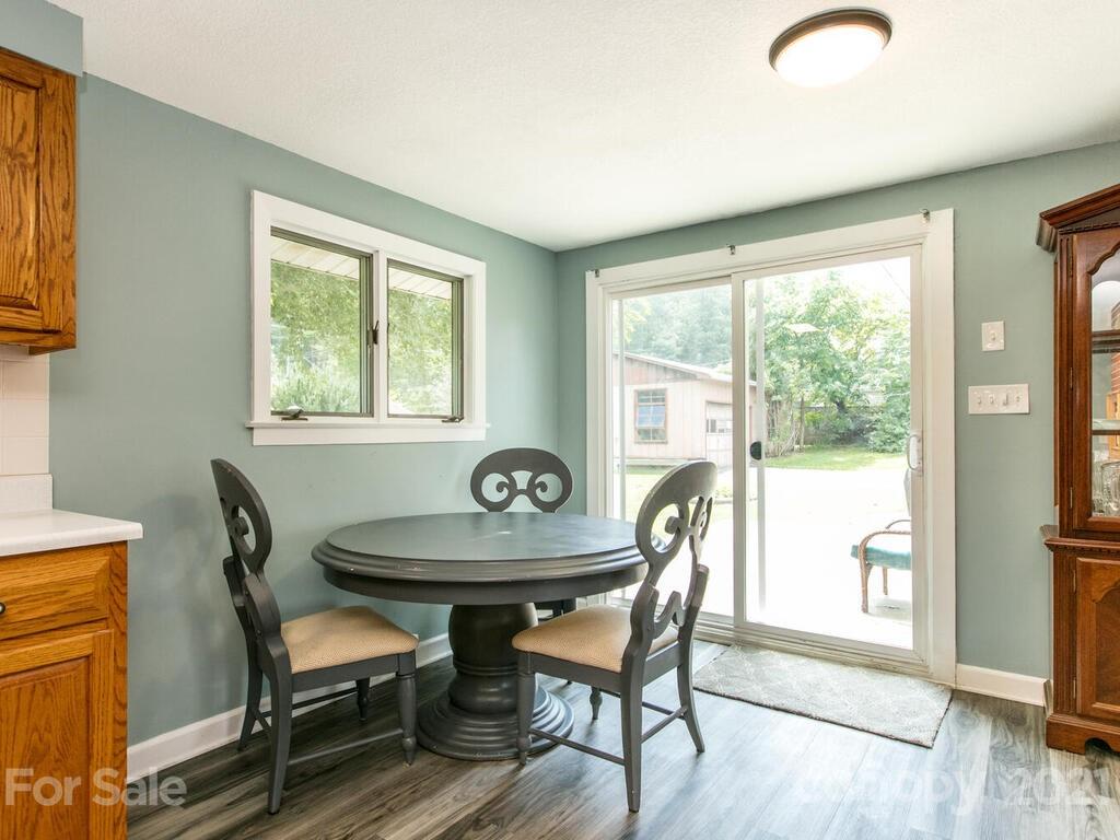 2044 Ridge Road Hendersonville, NC 28792 - Photo 14 of 37 a dining room with furniture and wooden floor