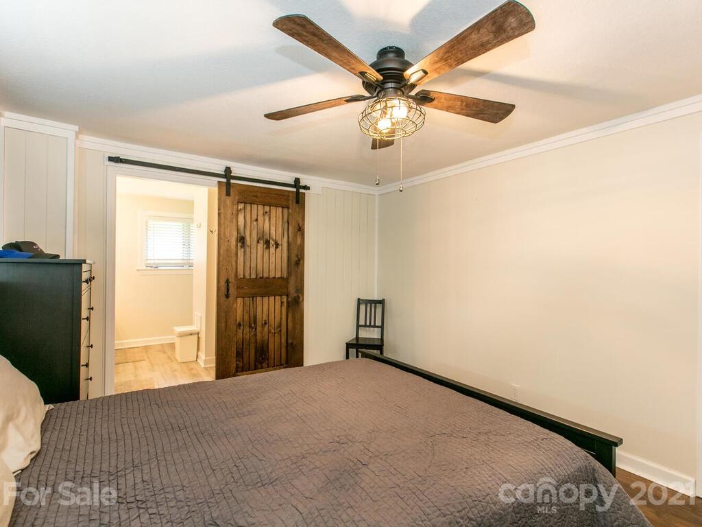 2044 Ridge Road Hendersonville, NC 28792 - Photo 21 of 37 a view of a livingroom with a flat screen tv