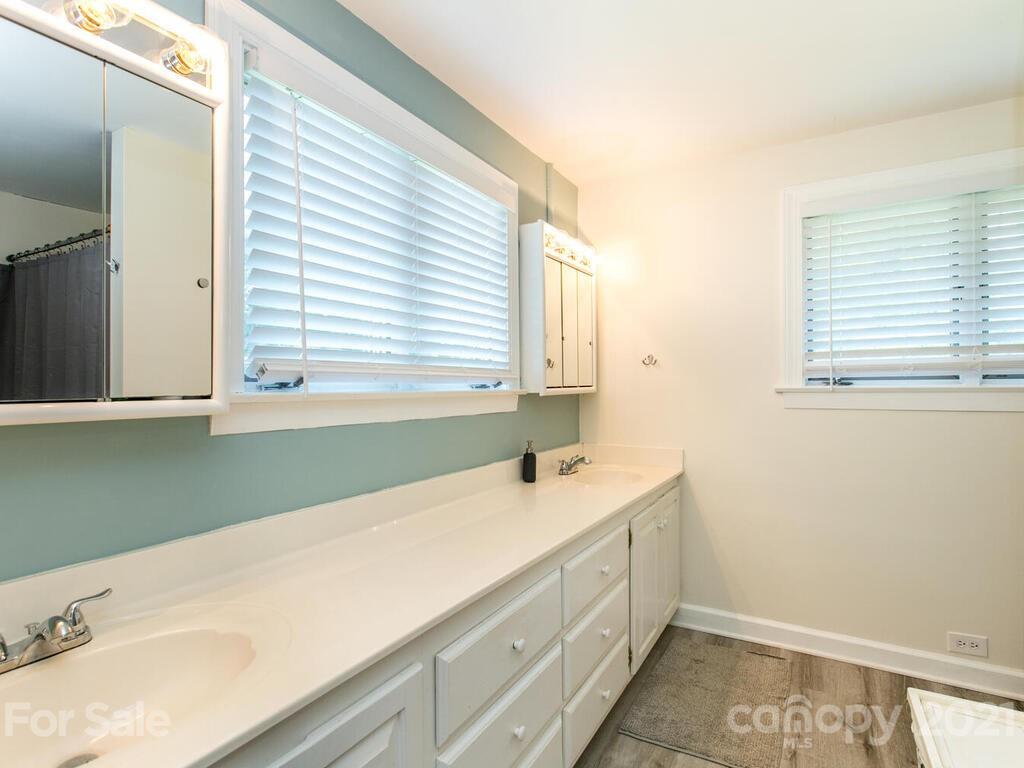 2044 Ridge Road Hendersonville, NC 28792 - Photo 23 of 37 a bathroom with a sink and a window