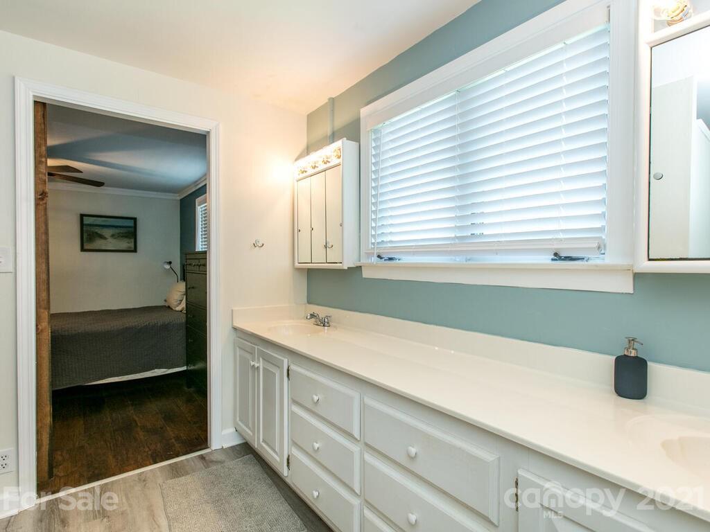 2044 Ridge Road Hendersonville, NC 28792 - Photo 24 of 37 a bathroom with a sink and a bathtub