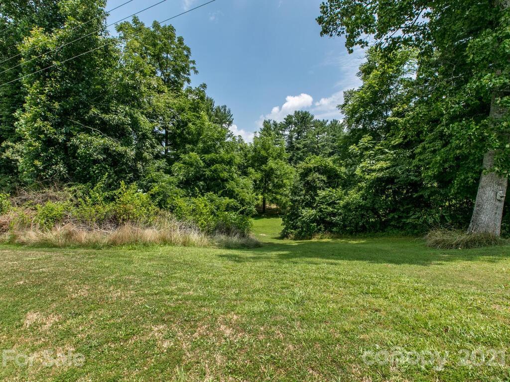 2044 Ridge Road Hendersonville, NC 28792 - Photo 34 of 37 a view of a grassy field with trees