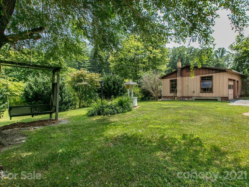 2044 Ridge Road Hendersonville, NC 28792 - Photo 35 of 37 a view of a house with backyard