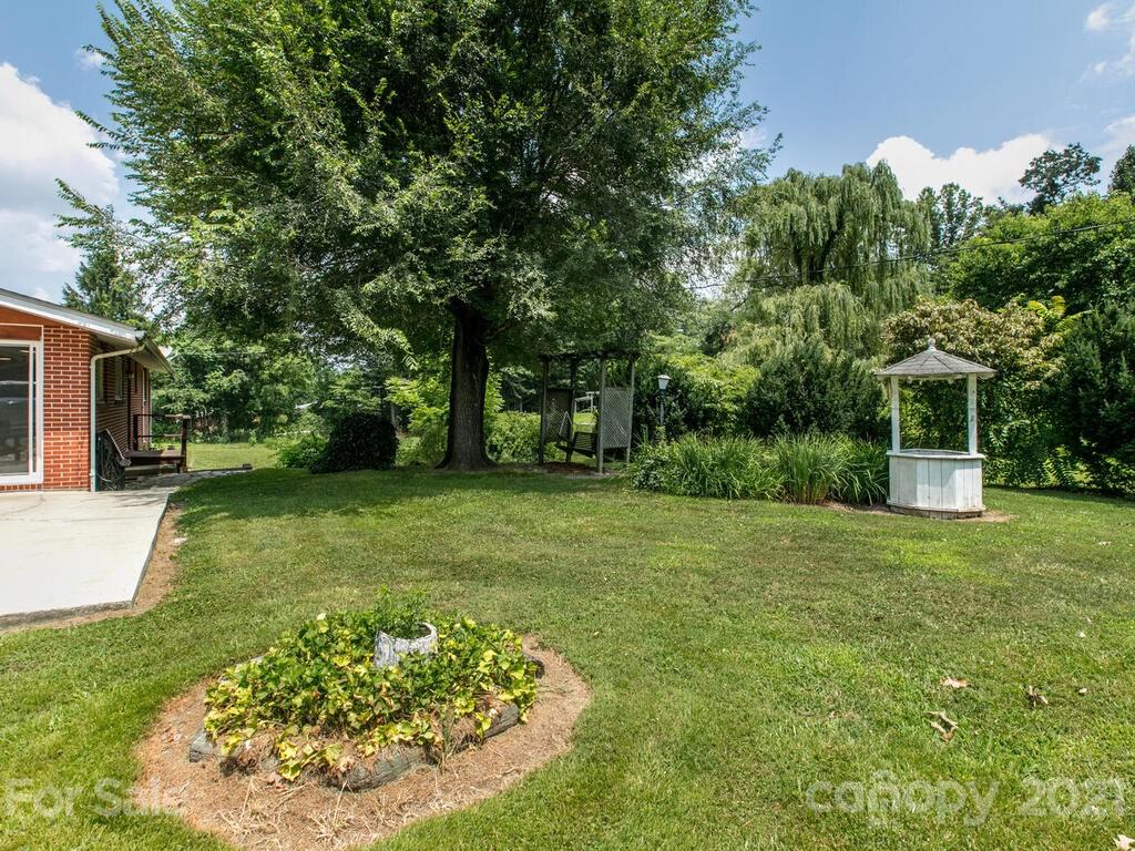 2044 Ridge Road Hendersonville, NC 28792 - Photo 36 of 37 a view of a backyard with a garden