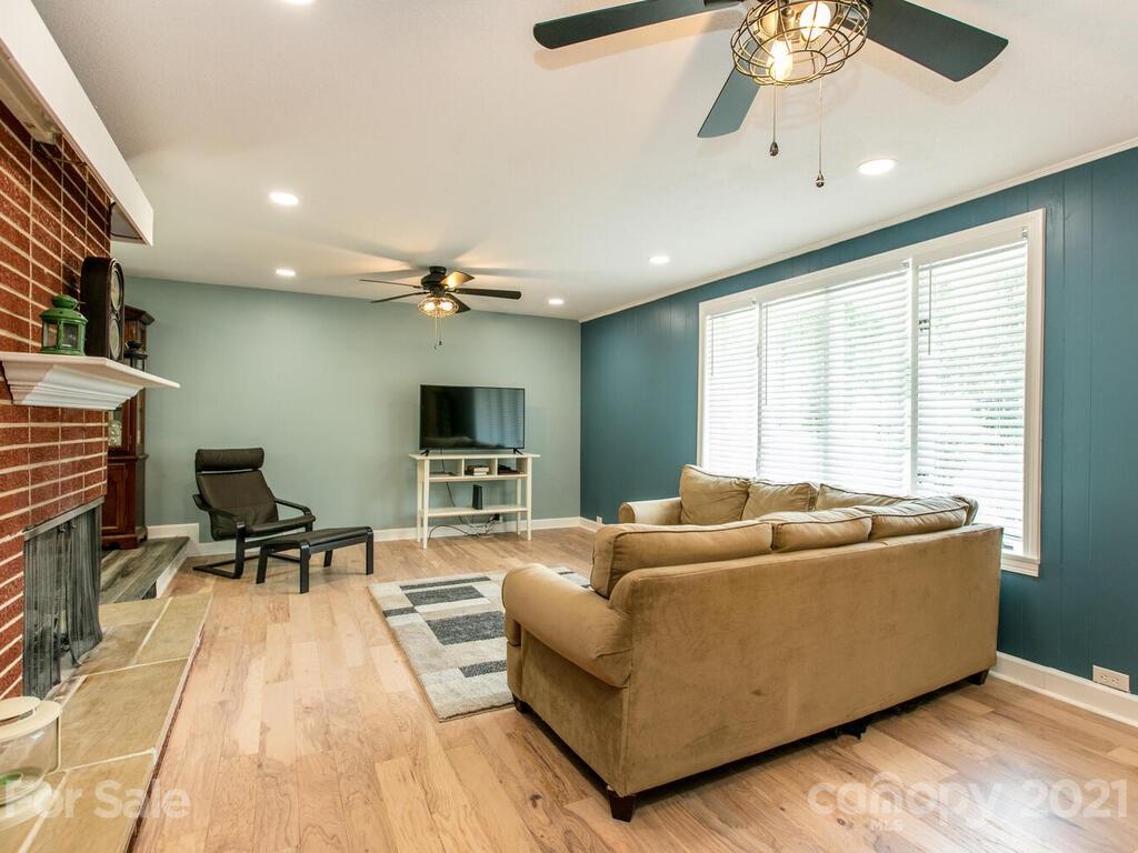 2044 Ridge Road Hendersonville, NC 28792 - Photo 6 of 37 a living room with furniture and a flat screen tv