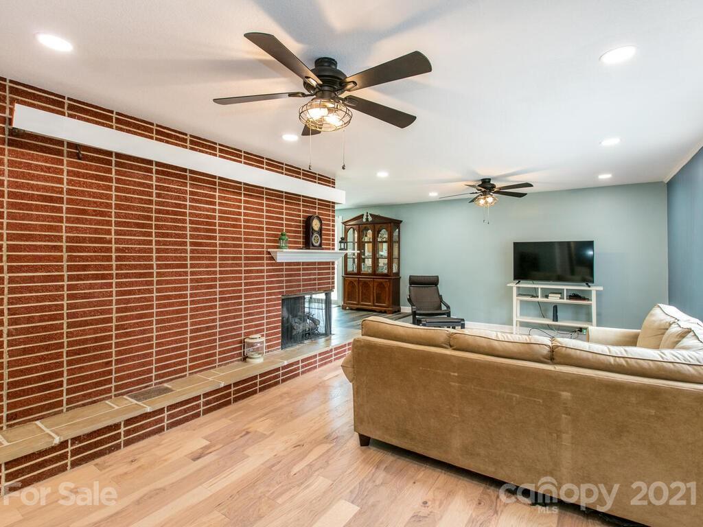 2044 Ridge Road Hendersonville, NC 28792 - Photo 7 of 37 a living room with furniture and a flat screen tv
