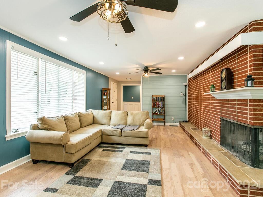 2044 Ridge Road Hendersonville, NC 28792 - Photo 10 of 37 a living room with furniture and a fireplace