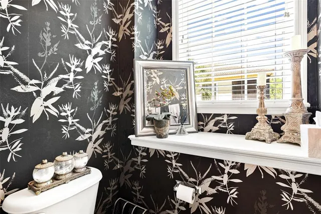 an aerial view of a house with a garden and swimming pool