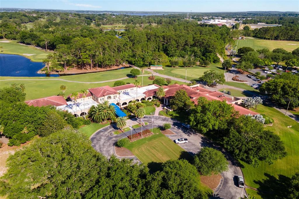 26142 Avenida Las Colinas, Unit 2B Howey-in-the-Hills, FL 34737 - Photo 65 of 78 an aerial view of a house with a garden and swimming pool