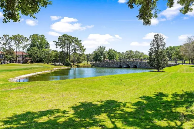 a view of a swimming pool with an outdoor space and seating area