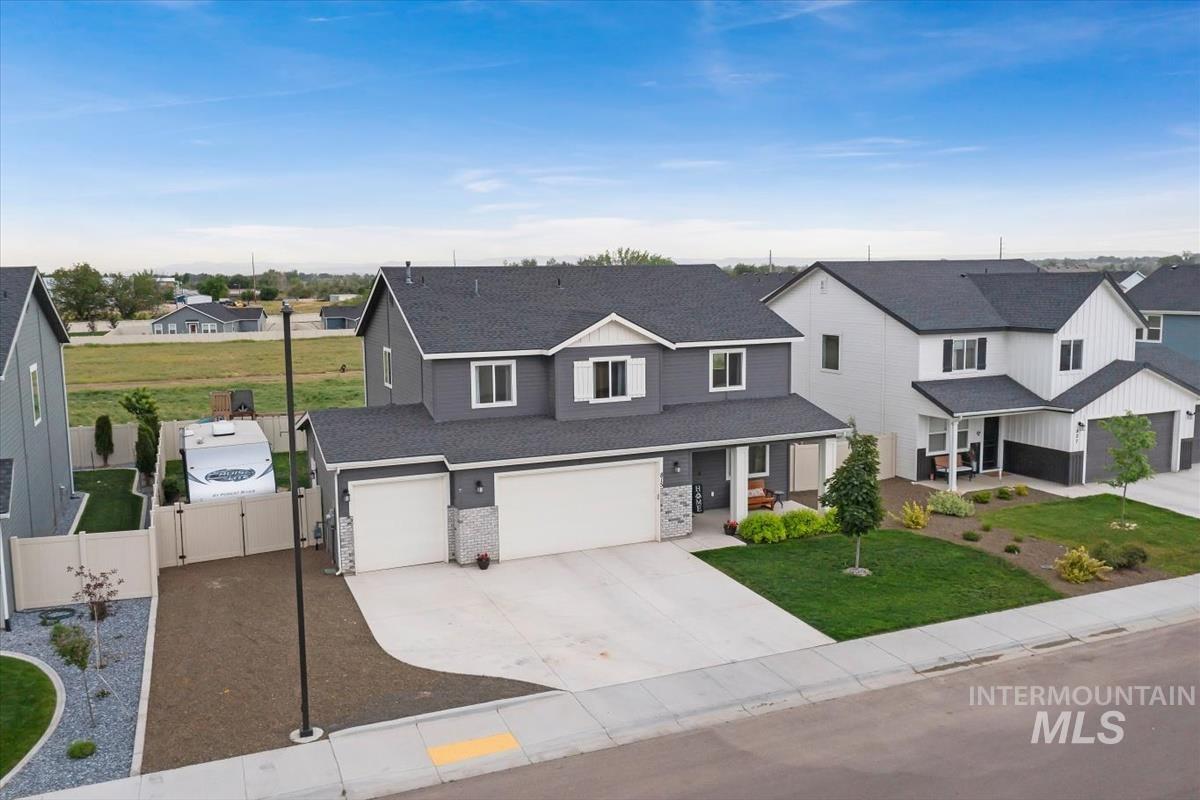 815 Knowledge Street Middleton, ID 83644 - Photo 2 of 49 Contemporary residence featuring a two-story design and a gray exterior with stone accents