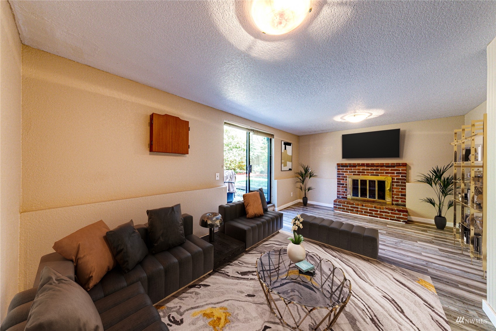 1027 233rd Place Southwest Bothell, WA 98021 - Photo 11 of 27 a living room with furniture and a flat screen tv