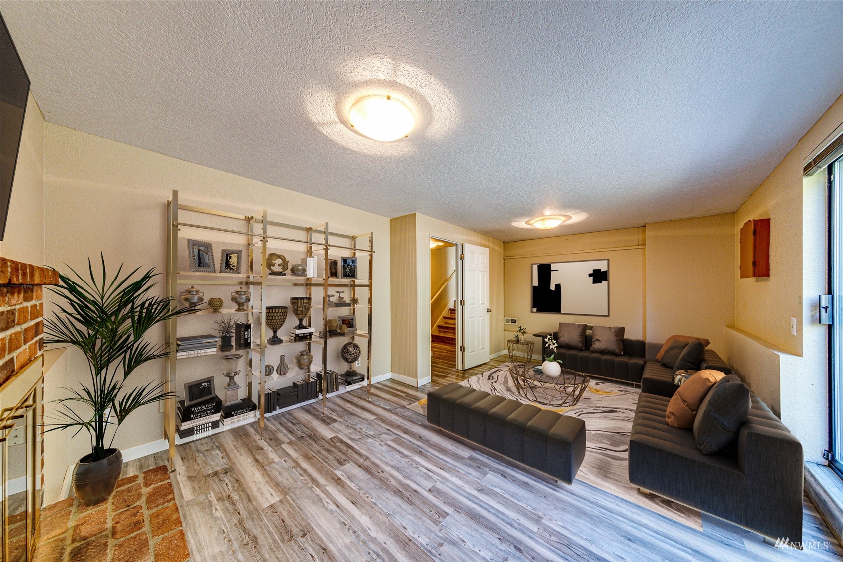1027 233rd Place Southwest Bothell, WA 98021 - Photo 12 of 27 a living room with furniture and wooden floor