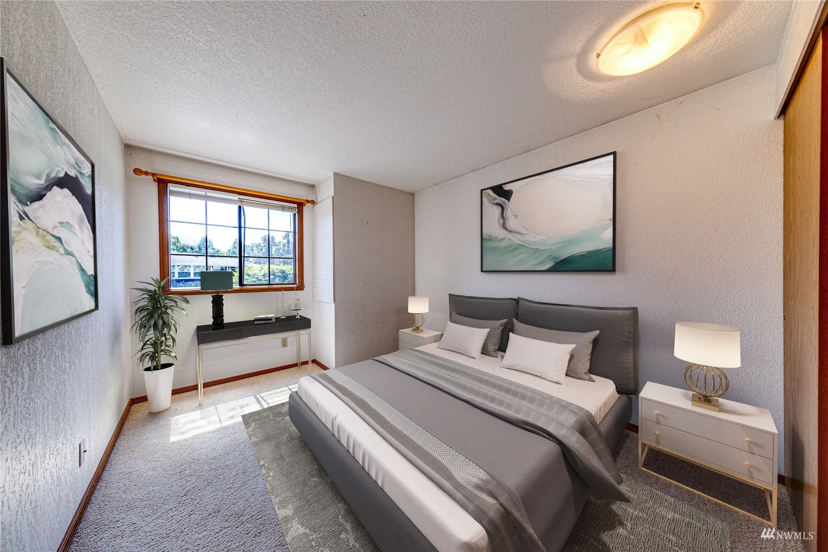 1027 233rd Place Southwest Bothell, WA 98021 - Photo 16 of 27 a bedroom with a bed and a flat screen tv