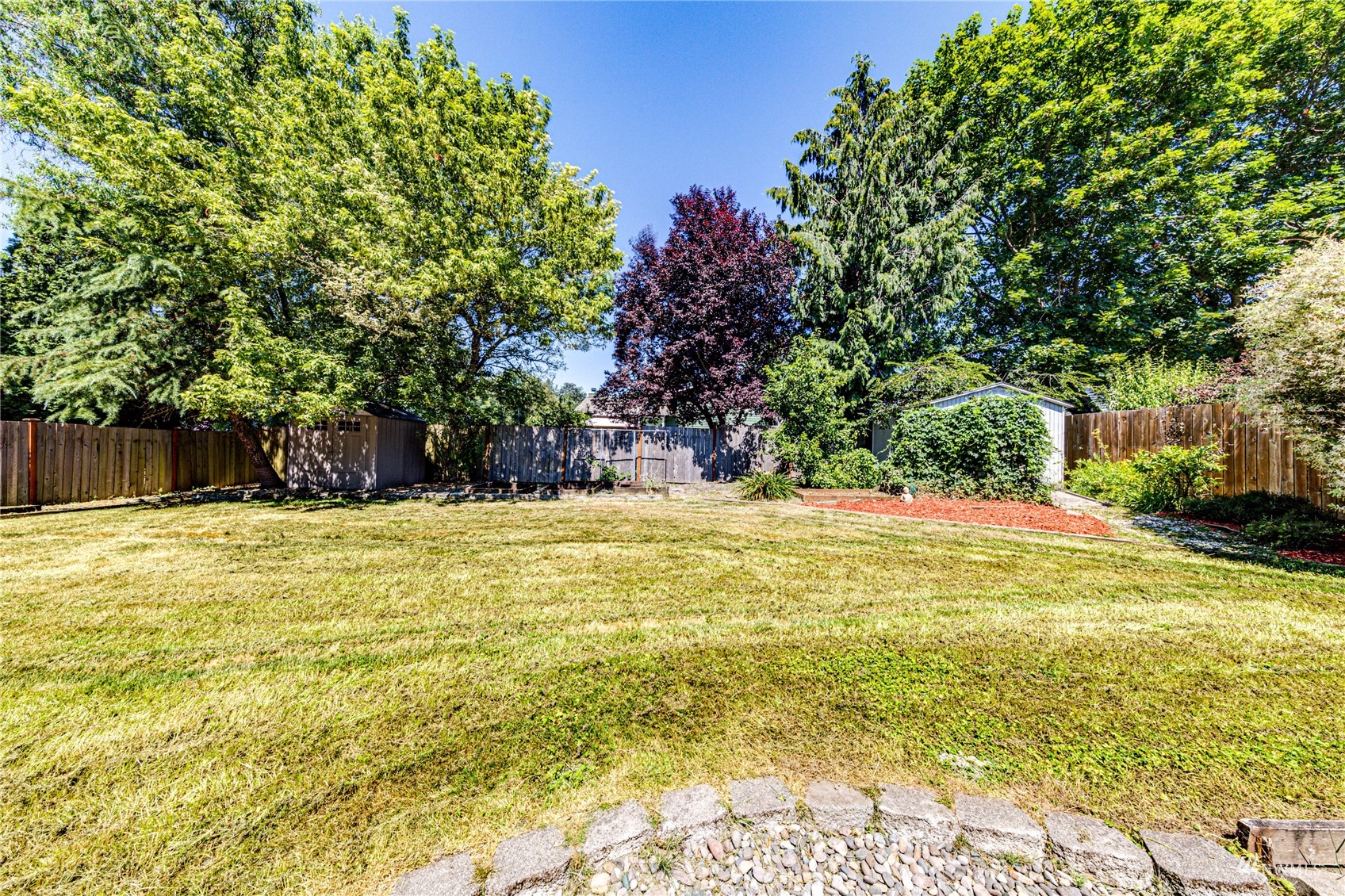 1027 233rd Place Southwest Bothell, WA 98021 - Photo 21 of 27 a swimming pool with trees in the background