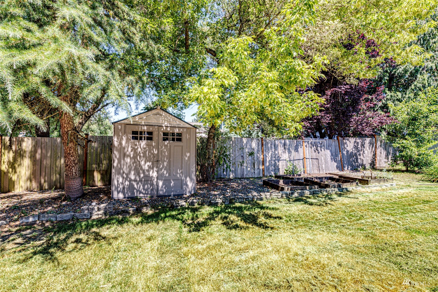 1027 233rd Place Southwest Bothell, WA 98021 - Photo 22 of 27 a backyard of a house with lots of green space