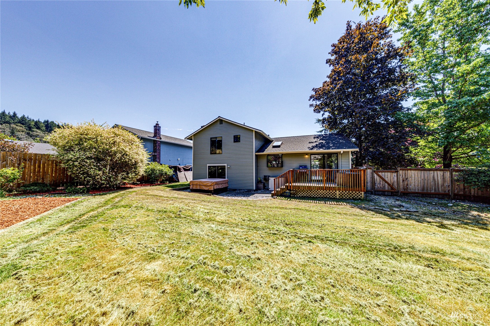 1027 233rd Place Southwest Bothell, WA 98021 - Photo 23 of 27 a house view with a outdoor space