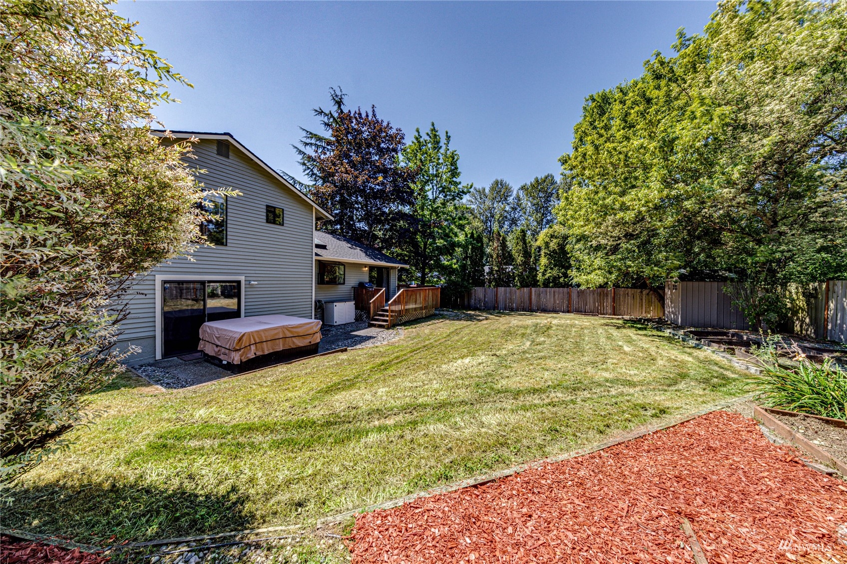 1027 233rd Place Southwest Bothell, WA 98021 - Photo 26 of 27 a backyard of a house with yard and entertaining space