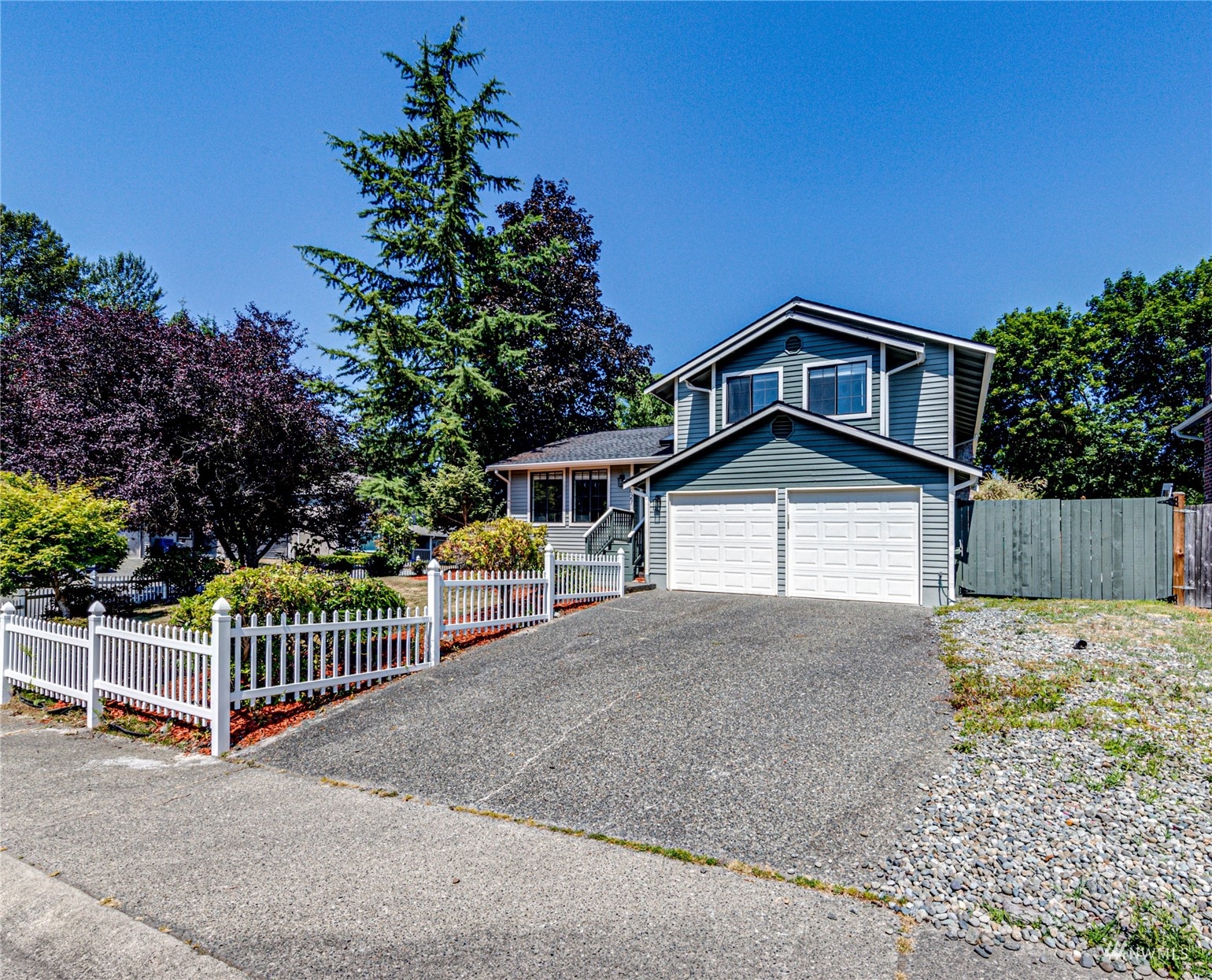 1027 233rd Place Southwest Bothell, WA 98021 - Photo 27 of 27 a front view of a house with a yard
