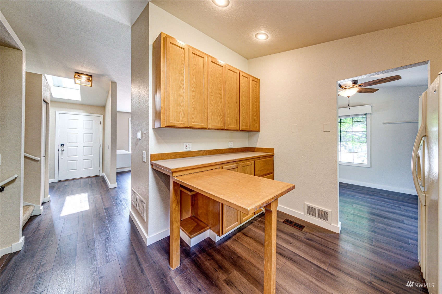 1027 233rd Place Southwest Bothell, WA 98021 - Photo 10 of 27 a room with wooden floor and windows