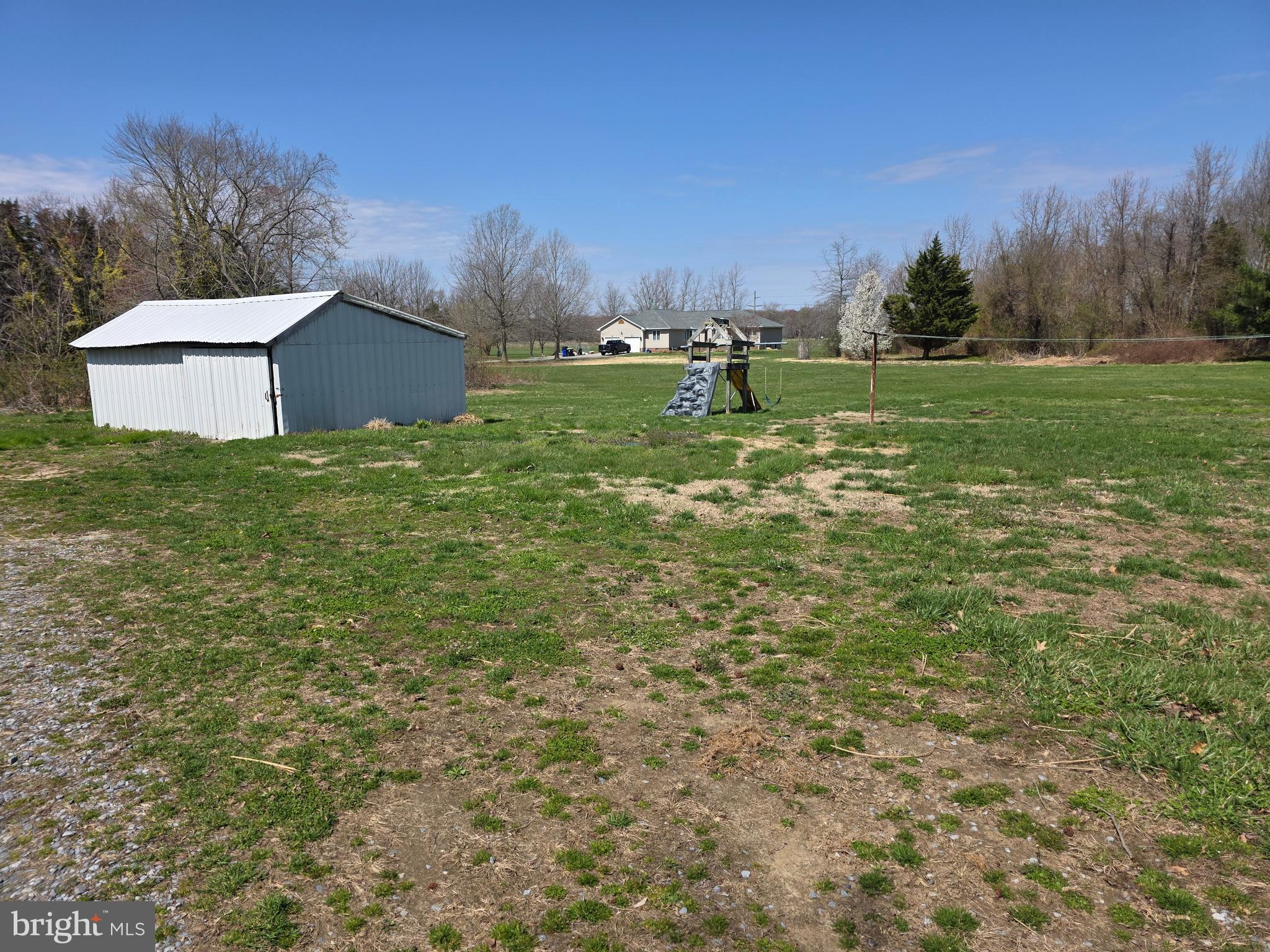 697 West Denneys Road Dover, DE 19904 - Photo 3 of 16 a backyard of a house with lots of green space