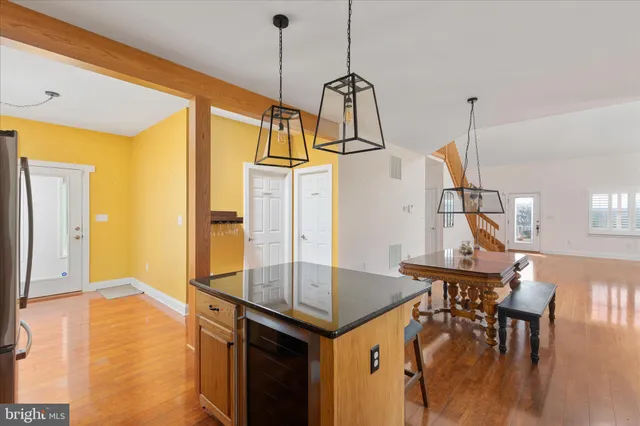 a view of kitchen and dining room with wooden floor