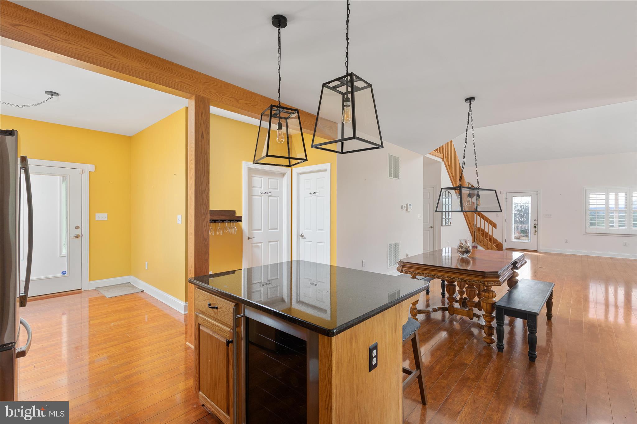 882 Liberty Furnace Road Edinburg, VA 22824 - Photo 11 of 47 a view of kitchen and dining room with wooden floor