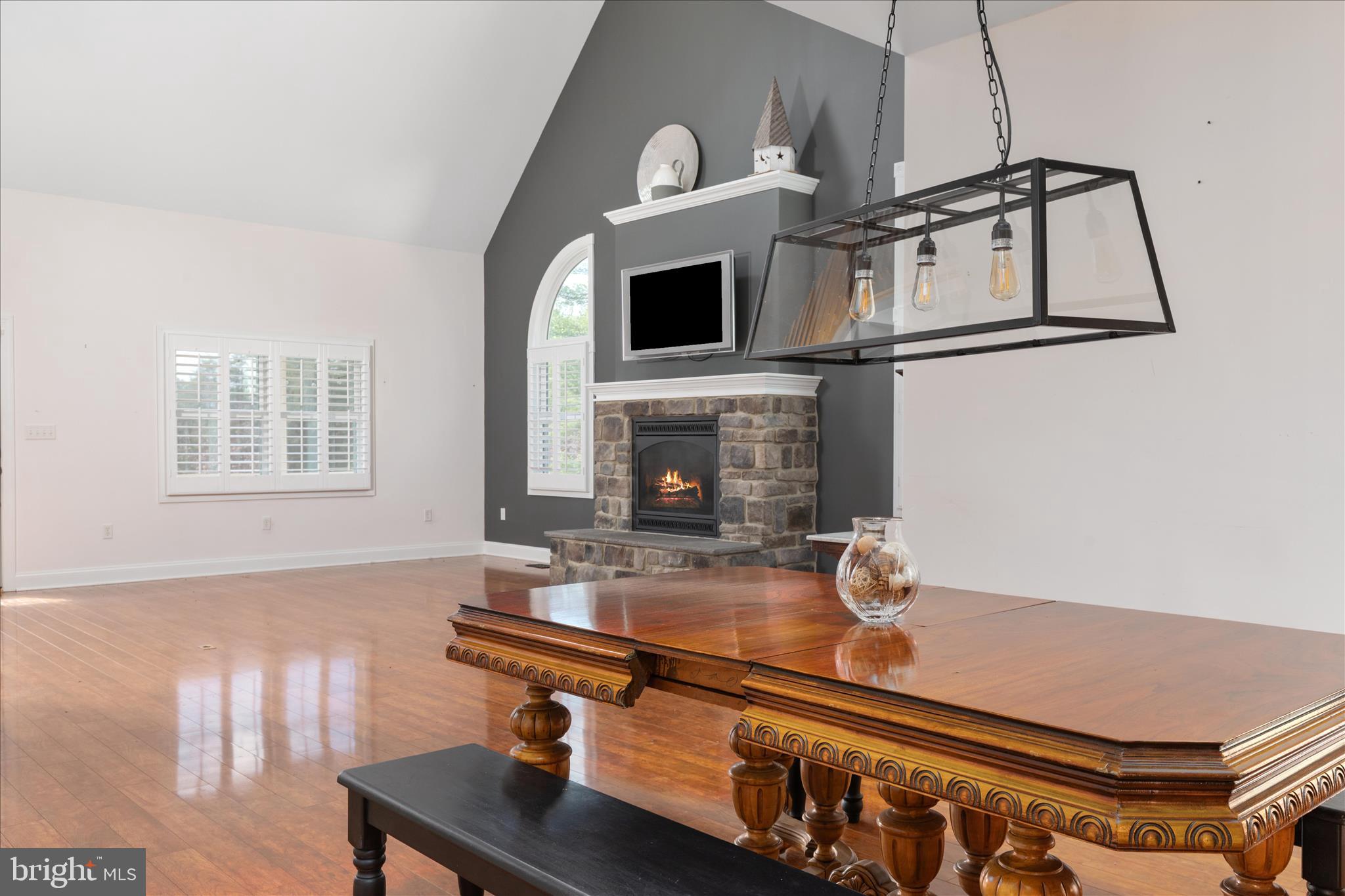 882 Liberty Furnace Road Edinburg, VA 22824 - Photo 14 of 47 a kitchen with stainless steel appliances granite countertop a stove and a wooden floor