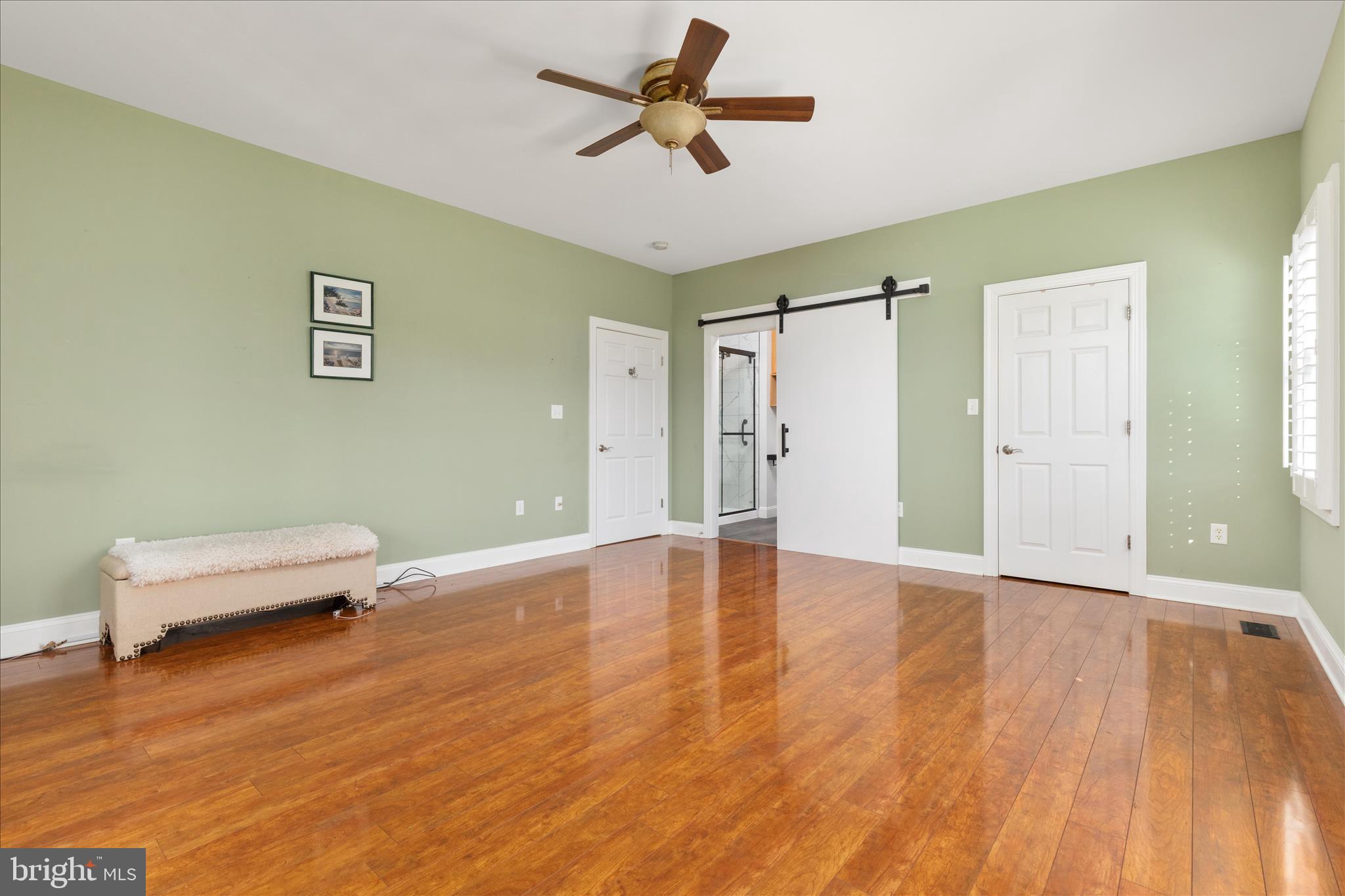 882 Liberty Furnace Road Edinburg, VA 22824 - Photo 19 of 47 a view of room with hardwood floor and a ceiling fan