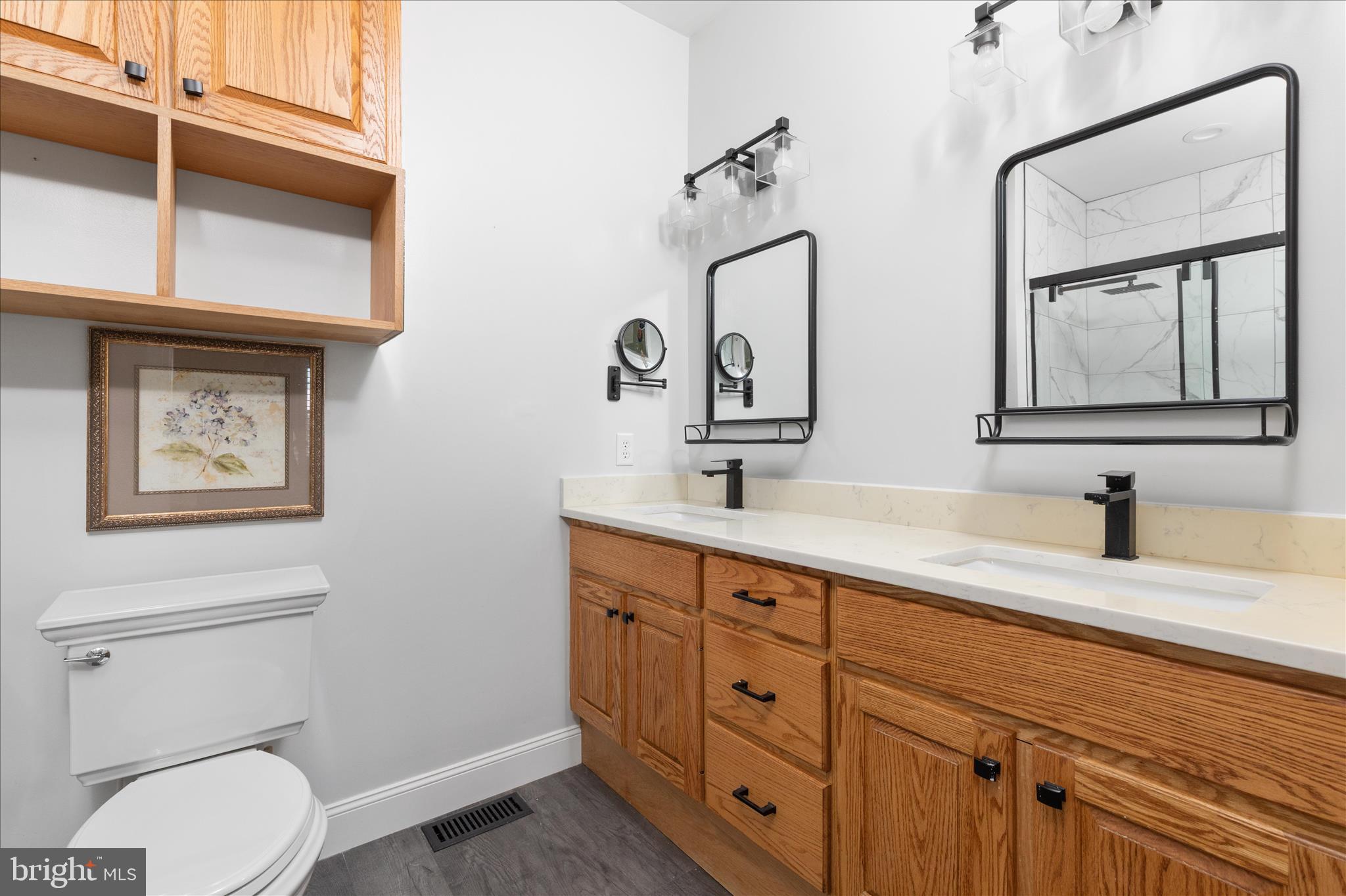 882 Liberty Furnace Road Edinburg, VA 22824 - Photo 20 of 47 a bathroom with a toilet sink and mirror