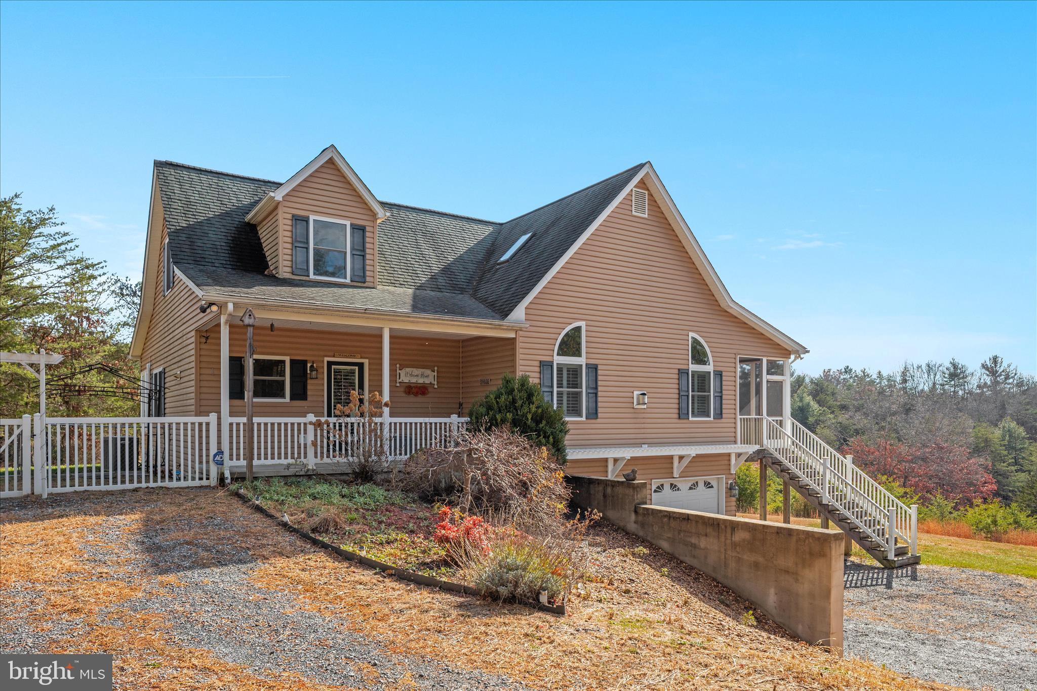 882 Liberty Furnace Road Edinburg, VA 22824 - Photo 2 of 47 a front view of a house with garden