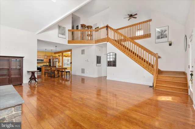 a bedroom with a bed and a flat tv screen on a dresser