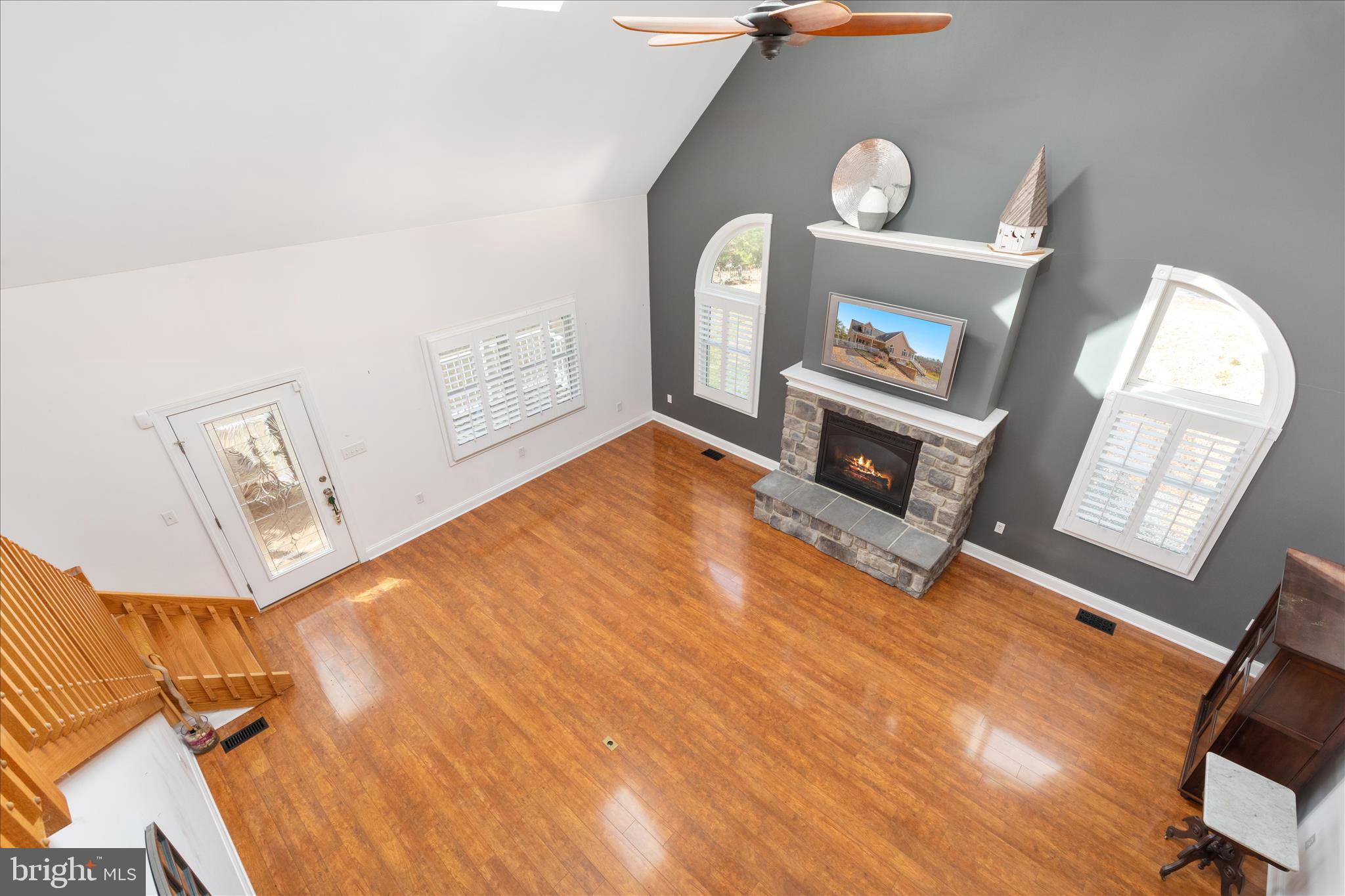 882 Liberty Furnace Road Edinburg, VA 22824 - Photo 25 of 47 a bedroom with a bed and a flat tv screen on a dresser