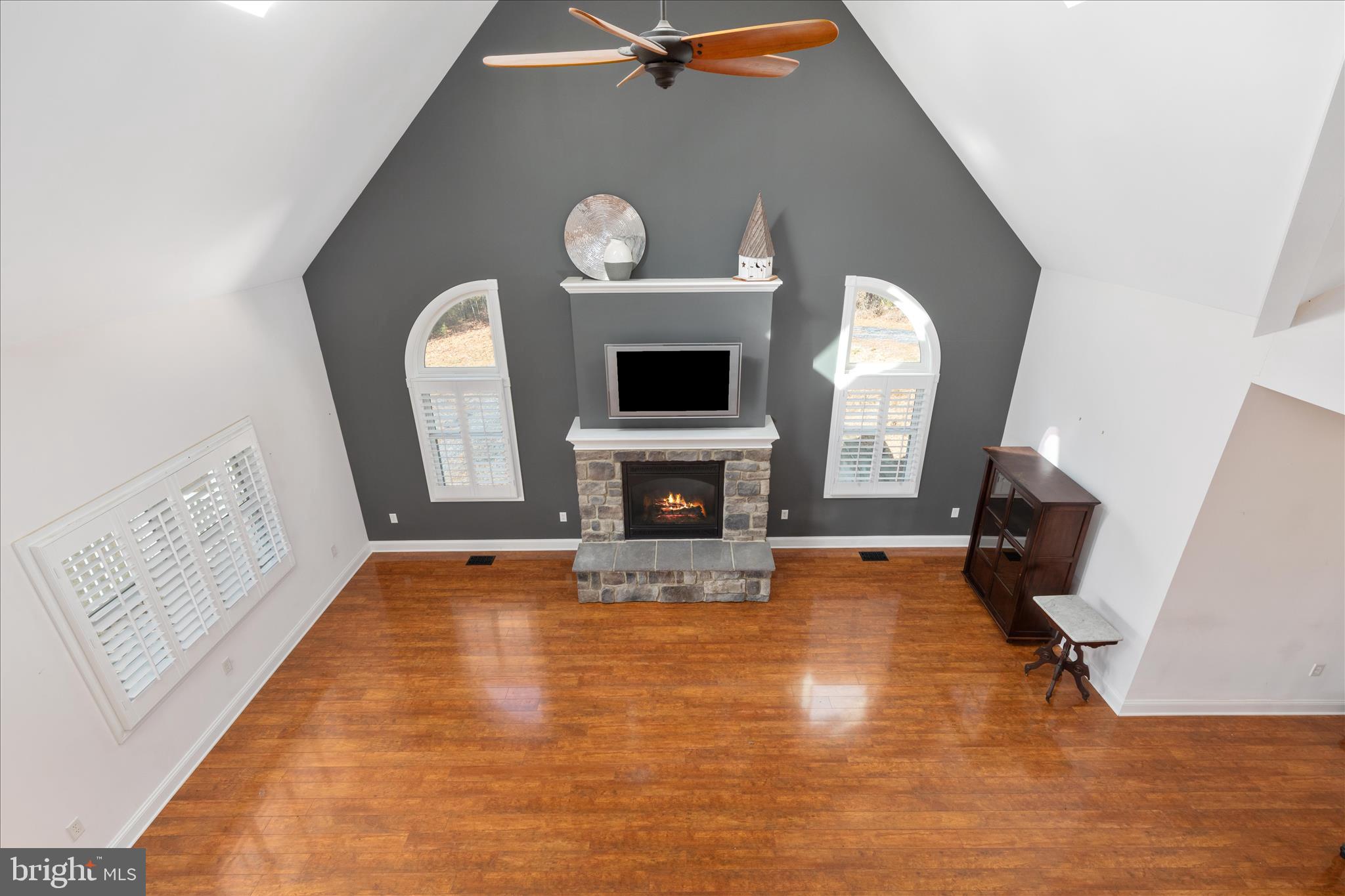882 Liberty Furnace Road Edinburg, VA 22824 - Photo 28 of 47 a view of a livingroom with a fireplace a window and a fireplace
