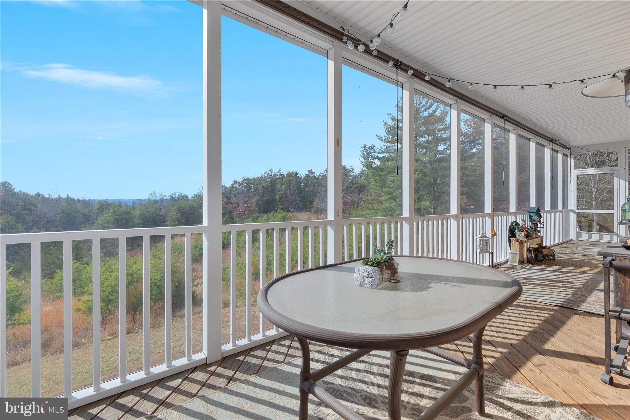 882 Liberty Furnace Road Edinburg, VA 22824 - Photo 39 of 47 a view of a balcony with a table and chairs