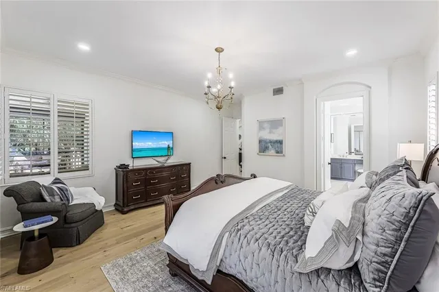 a bedroom with bed furniture and a window