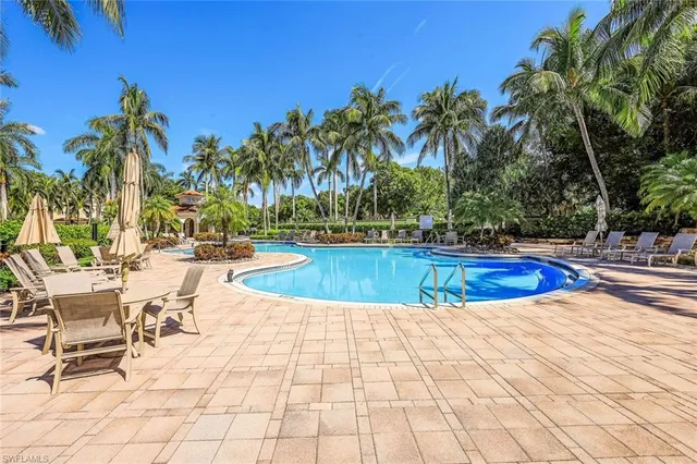 a view of swimming pool with chairs