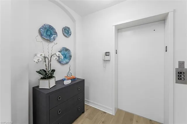 a table with a vase of flowers on a table