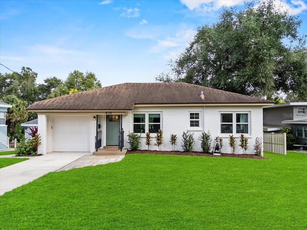 838 Hollingsworth Road Lakeland, FL 33801 - Photo 1 of 1 a front view of house with yard with green space