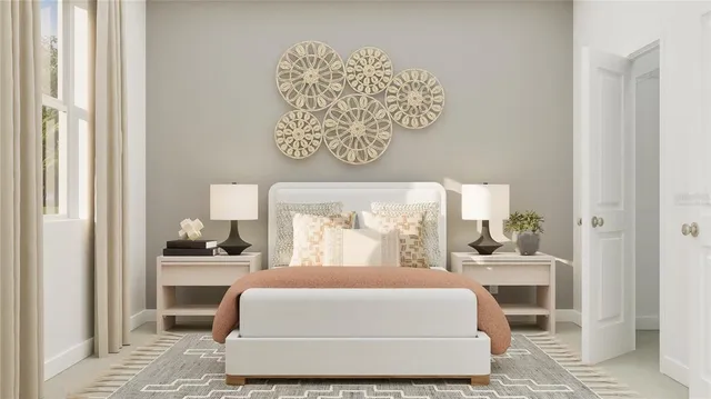 a bedroom with a large bed and a window