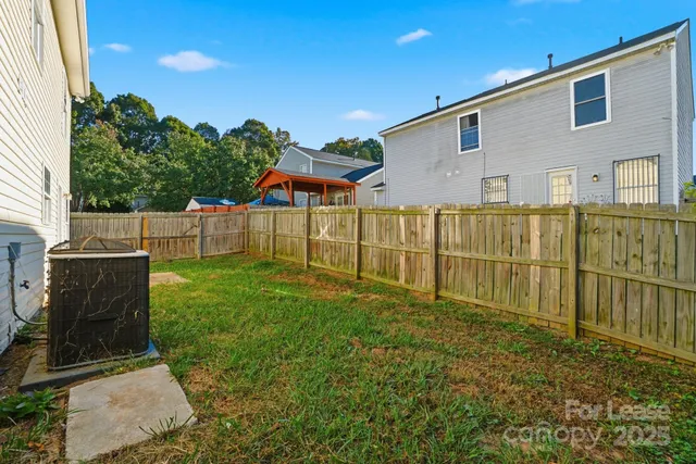 a view of backyard with green space