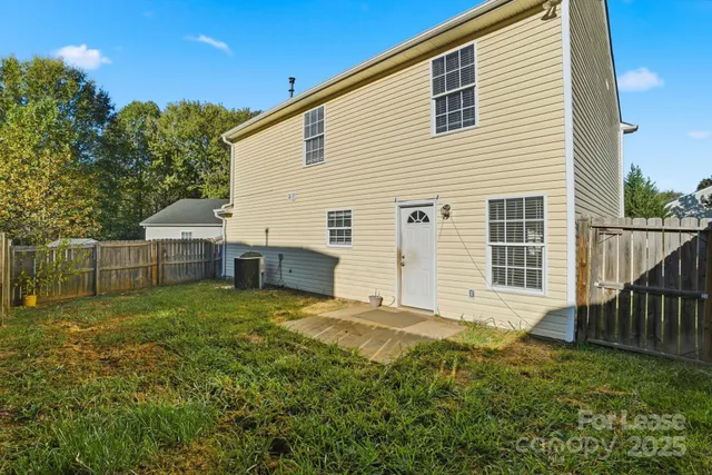 a view of backyard with deck and backyard
